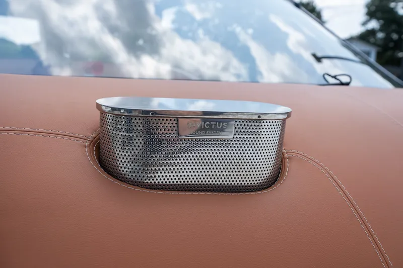 Slide: The Image of Invictus TT430 2025 sound system detail on luxury leather dashboard. - 46