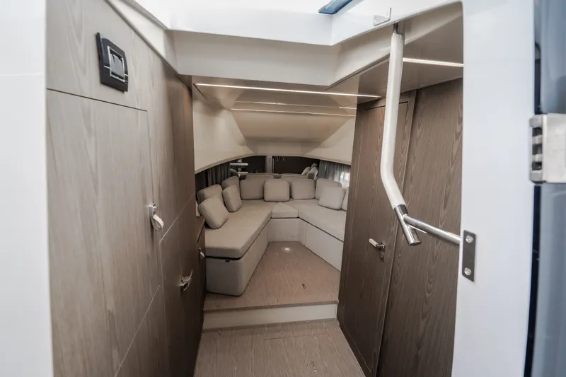Slide: The Image of Luxurious interior of 2025 Invictus TT430 yacht with modern seating and wooden finishes. - 75