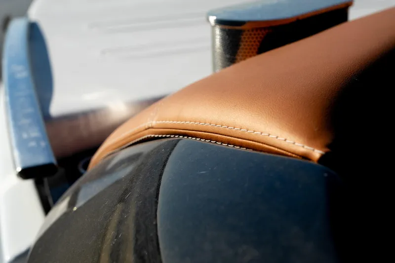 Slide: The Image of Close-up of Invictus TT430 2025 leather upholstery and sleek design details. - 9
