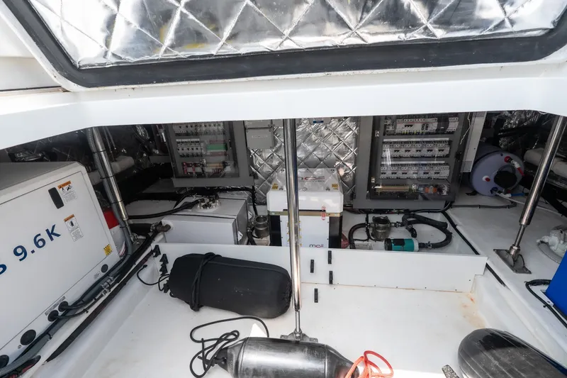 Slide: The Image of Engine room of 2025 Invictus TT430 yacht, showcasing equipment and control panels. - 17