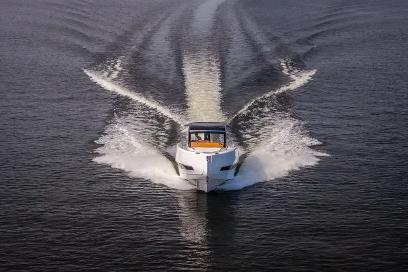 Slide: The Image of Front view of 2025 Invictus TT430 yacht cruising on open water. - 108