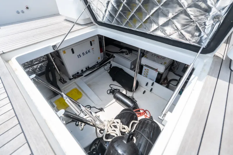 Slide: The Image of Engine compartment of 2025 Invictus TT430 yacht, showcasing equipment and storage space. - 16