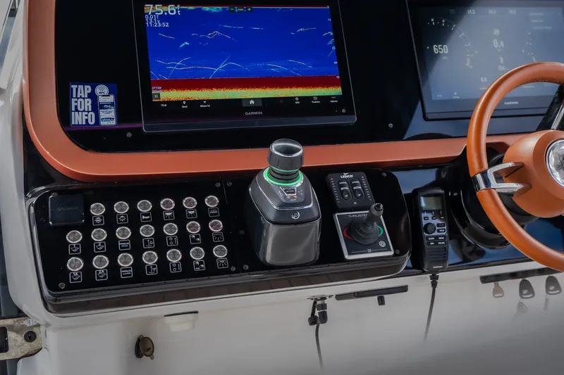 Slide: The Image of Control panel of 2025 Invictus TT430 boat with advanced navigation and steering systems. - 45