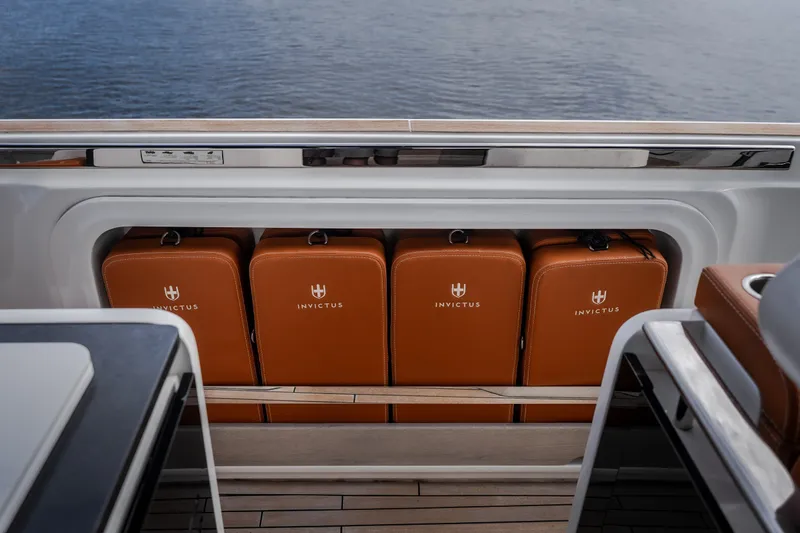 Slide: The Image of Luxury leather seats on 2025 Invictus TT430 yacht, docked by the water. - 47