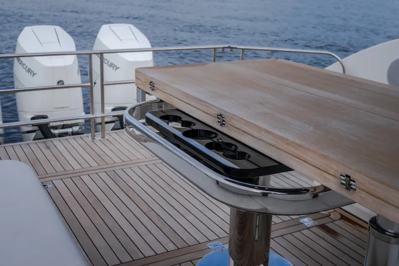 Slide: The Image of Luxury yacht Invictus TT430 2025 with wooden deck and dual Mercury outboard engines. - 64
