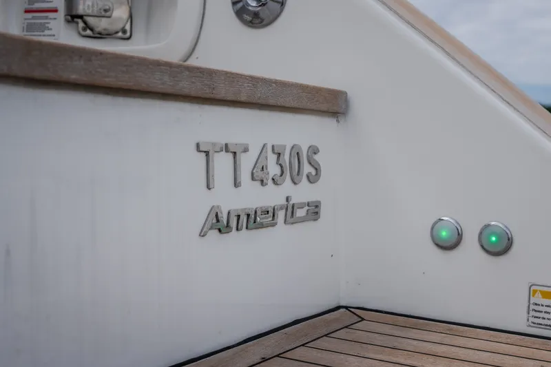 Slide: The Image of 2025 Invictus TT430 boat with "America" branding and green indicator lights. - 27