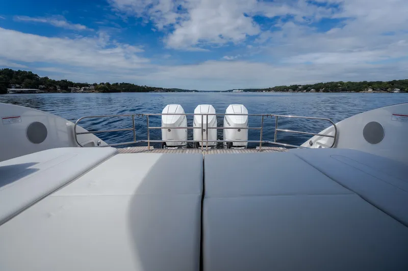 Slide: The Image of Luxurious 2025 Invictus TT430 yacht with triple engines on a serene lake. - 17