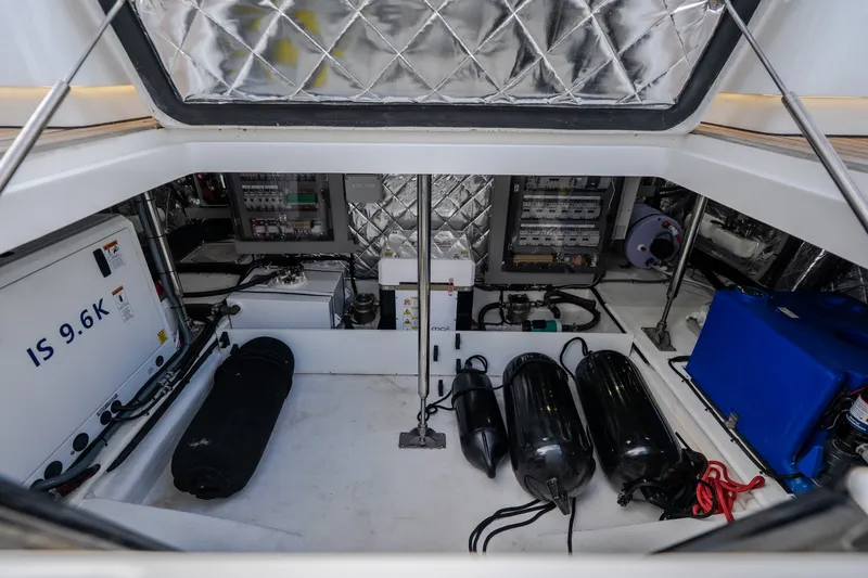 Slide: The Image of Engine compartment of 2025 Invictus TT430 yacht, featuring advanced equipment and storage tanks. - 84