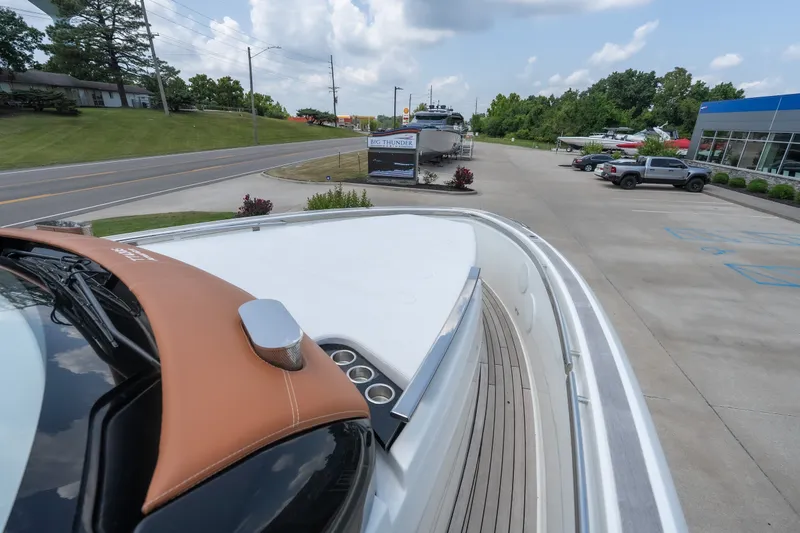 Slide: The Image of 2025 Invictus TT430 boat parked near dealership, showcasing sleek design and modern features. - 47