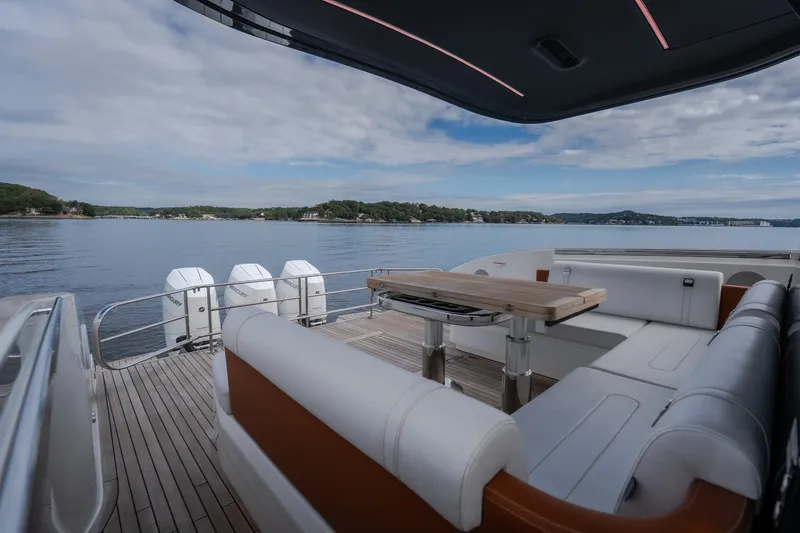 Slide: The Image of Luxurious 2025 Invictus TT430 yacht with spacious deck and scenic water view. - 20