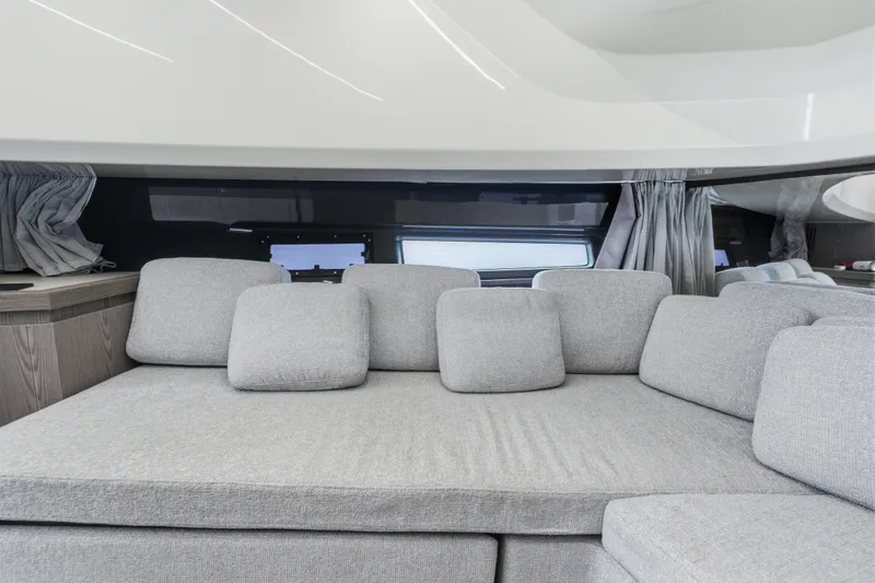 Slide: The Image of Luxurious interior of 2025 Invictus TT430 yacht with plush gray seating and modern design. - 81