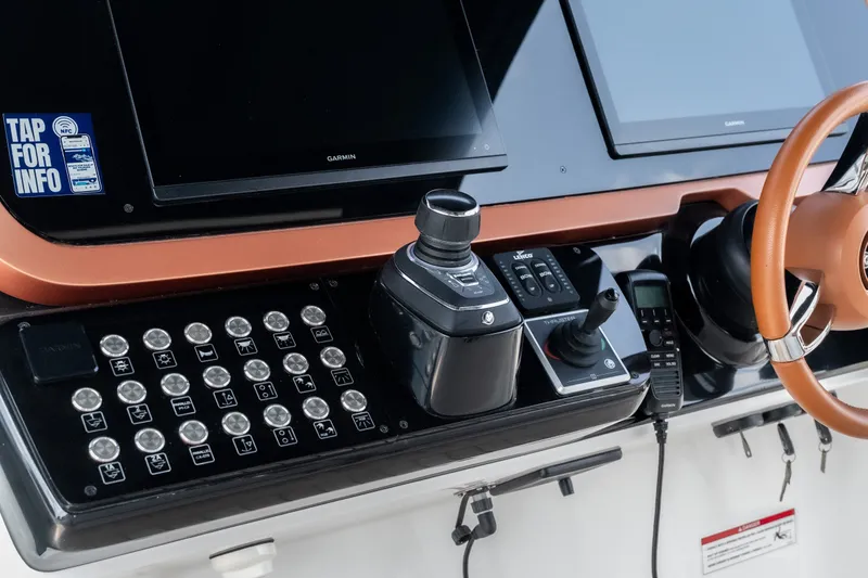 Slide: The Image of 2025 Invictus TT430 yacht dashboard with advanced controls and navigation screens. - 34