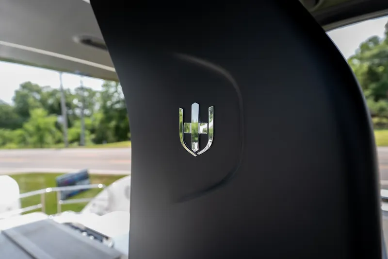 Slide: The Image of Close-up of Invictus TT430 logo on a sleek black surface, 2025 model. - 26