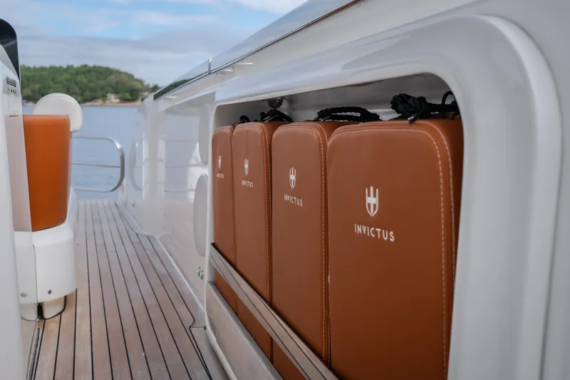 Slide: The Image of 2025 Invictus TT430 yacht interior with branded leather storage compartments. - 51