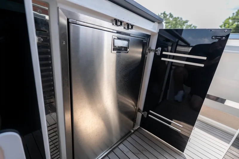 Slide: The Image of Stainless steel appliance on Invictus TT430 yacht, 2025 model, with sleek modern design. - 29