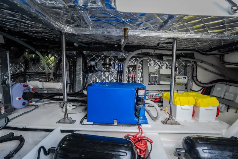 Slide: The Image of Engine room of 2025 Invictus TT430 yacht with equipment and wiring. - 86