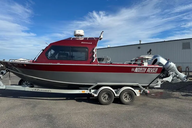 Slide: The Image of 2021 North River SEAHAWK 23 X 84 boat on trailer, parked outdoors. - 0