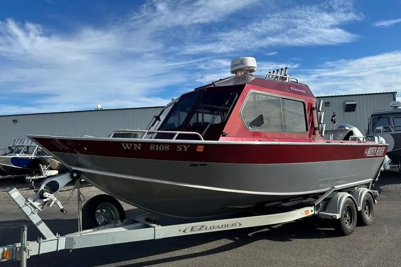 Slide: The Image of 2021 North River SEAHAWK 23 X 84 boat on trailer, parked outdoors. - 1