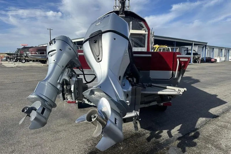 Slide: The Image of 2021 North River SEAHAWK 23 X 84 boat with dual outboard motors in a marina. - 3