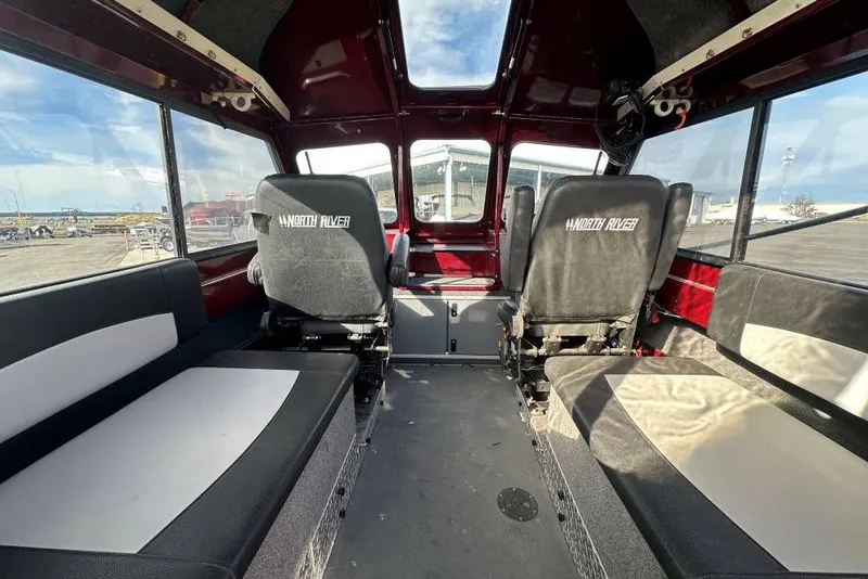 Slide: The Image of Interior of 2021 North River SEAHAWK 23 X 84 boat with seating and panoramic windows. - 5