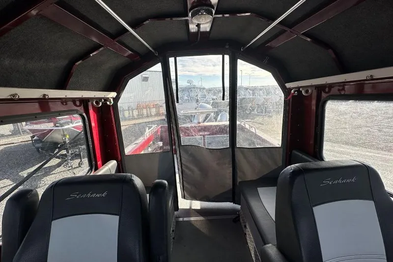 Slide: The Image of Interior of 2021 North River Seahawk 23 X 84 boat with seating and windows. - 8