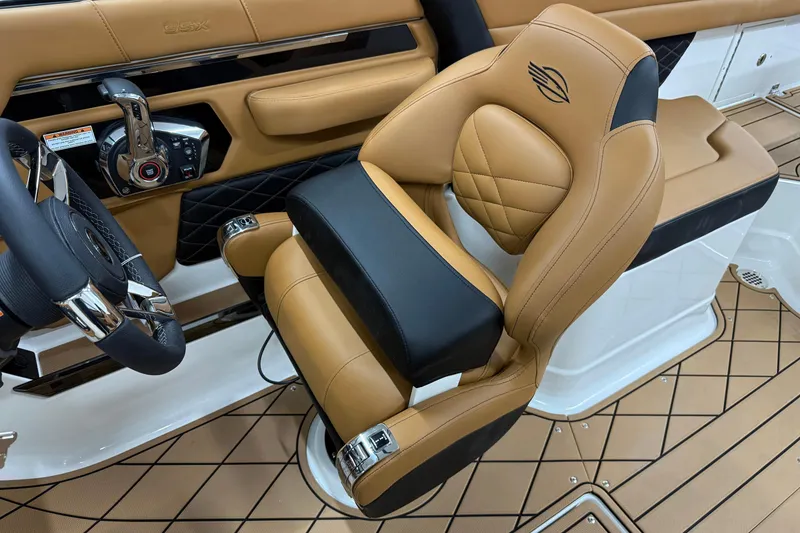 Slide: The Image of Luxury interior of 2026 Chaparral SSX 6 boat with tan leather seating and modern controls. - 10