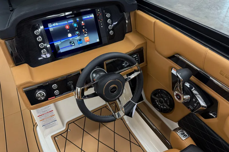 Slide: The Image of 2026 Chaparral SSX 6 boat dashboard with touchscreen, steering wheel, and controls. - 11