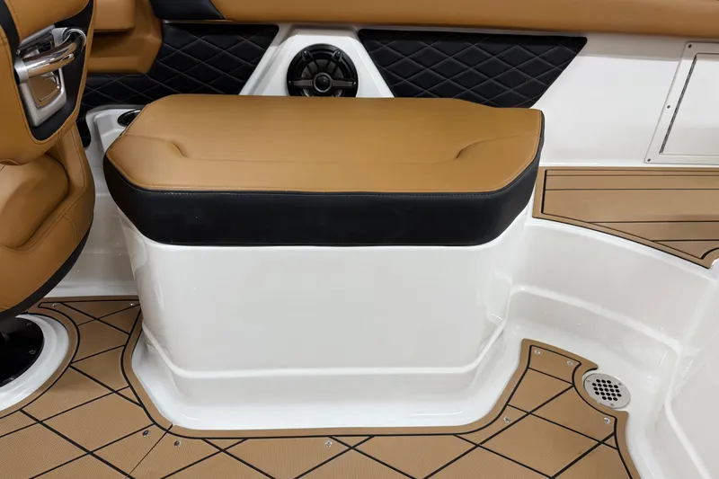 Slide: The Image of 2026 Chaparral SSX 6 interior seating with tan and black upholstery, featuring diamond-patterned accents. - 16