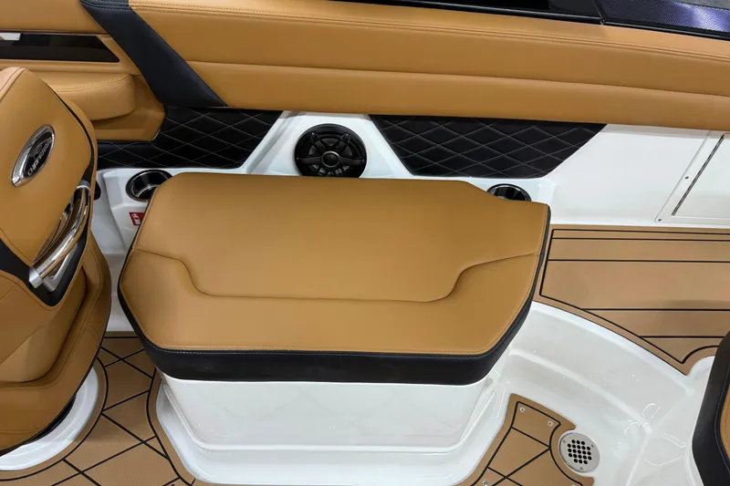 Slide: The Image of 2026 Chaparral SSX 6 boat interior with tan seating and black accents. - 18