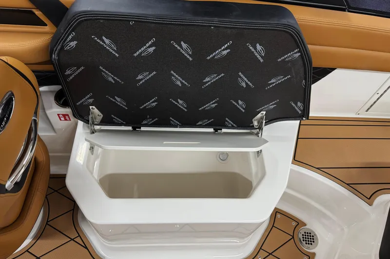 Slide: The Image of 2026 Chaparral SSX 6 boat interior storage compartment with open lid, showcasing sleek design. - 19