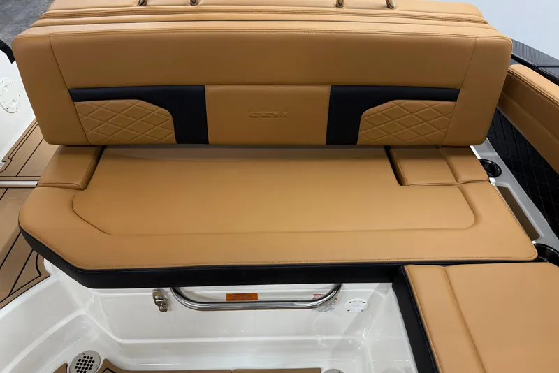 Slide: The Image of 2026 Chaparral SSX 6 boat interior with tan leather seating and diamond stitching. - 20