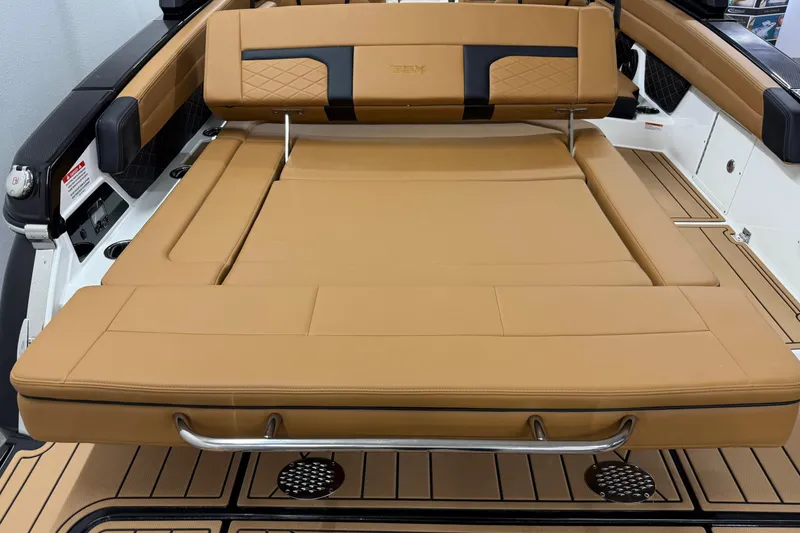 Slide: The Image of 2026 Chaparral SSX 6 boat with luxurious tan seating and sleek design. - 21