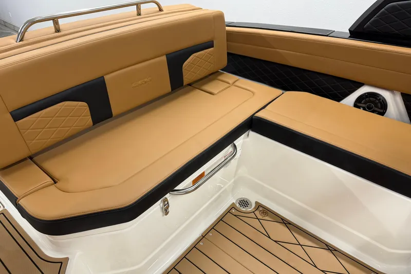Slide: The Image of 2026 Chaparral SSX 6 boat interior with tan and black seating, elegant design. - 22