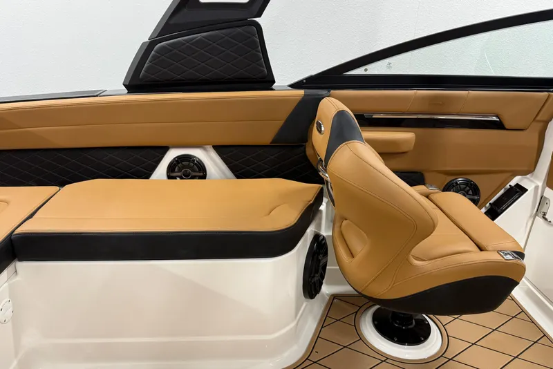 Slide: The Image of Luxurious interior of 2026 Chaparral SSX 6 boat with tan leather seating. - 23