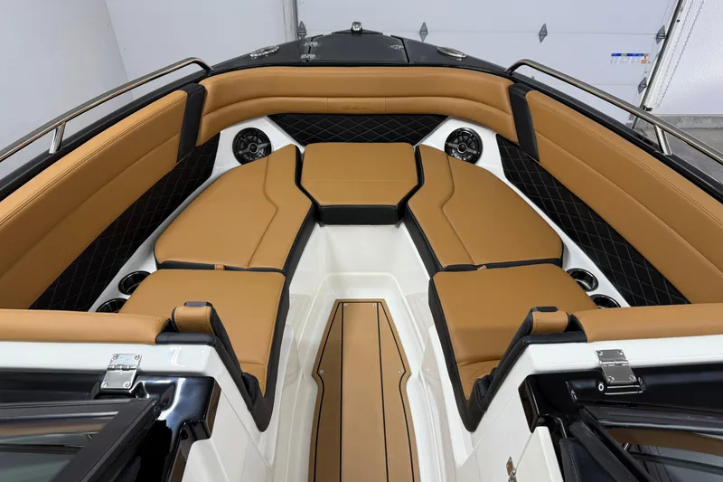 Slide: The Image of Luxurious interior of 2026 Chaparral SSX 6 boat with tan seating and sleek design. - 24