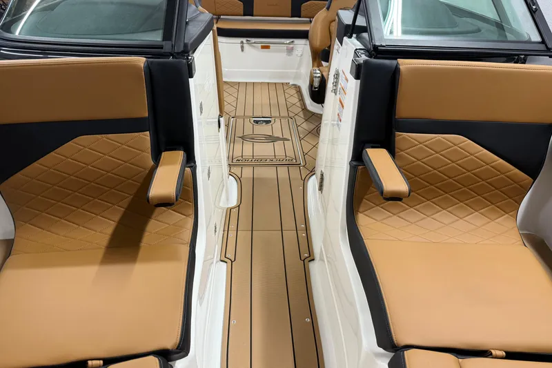 Slide: The Image of 2026 Chaparral SSX 6 boat interior with tan and black quilted seating. - 26
