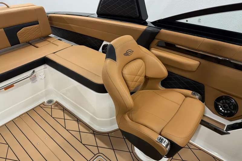 Slide: The Image of Luxurious interior of 2026 Chaparral SSX 6 boat with tan leather seating. - 31