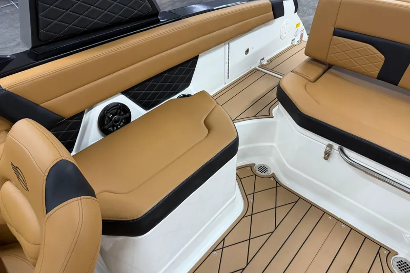 Slide: The Image of Luxurious tan and black seating in 2026 Chaparral SSX 6 boat interior. - 32