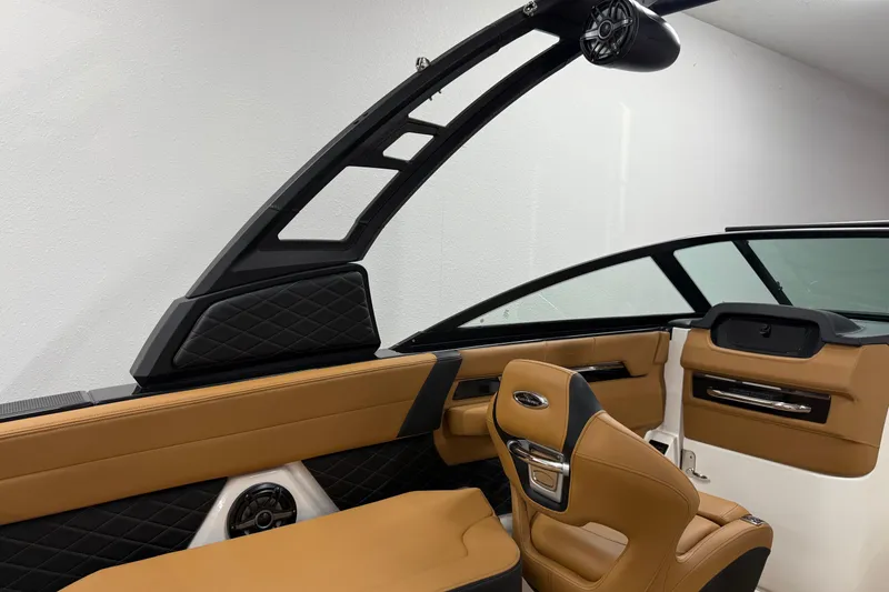Slide: The Image of 2026 Chaparral SSX 6 boat interior with tan leather seats and modern design. - 33