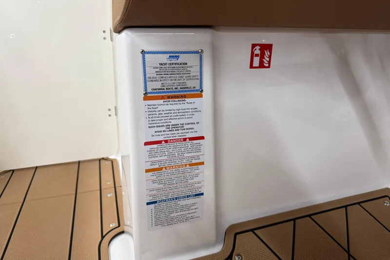 Slide: The Image of Safety instructions on 2026 Chaparral SSX 6 boat with fire extinguisher symbol. - 34