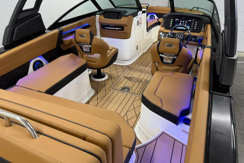 Slide: The Image of 2026 Chaparral SSX 6 boat interior with luxurious tan seating and modern dashboard. - 36