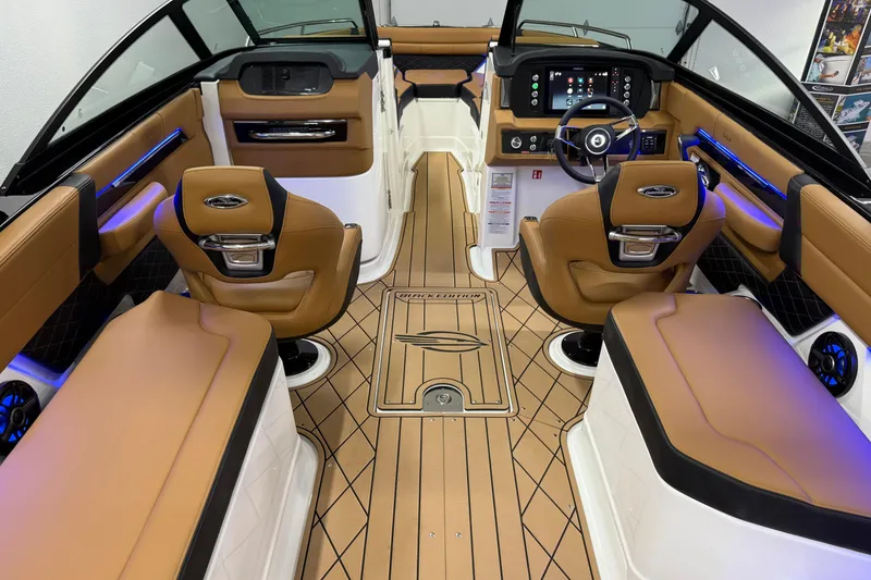 Slide: The Image of Luxurious interior of 2026 Chaparral SSX 6 boat with tan leather seating and modern dashboard. - 45