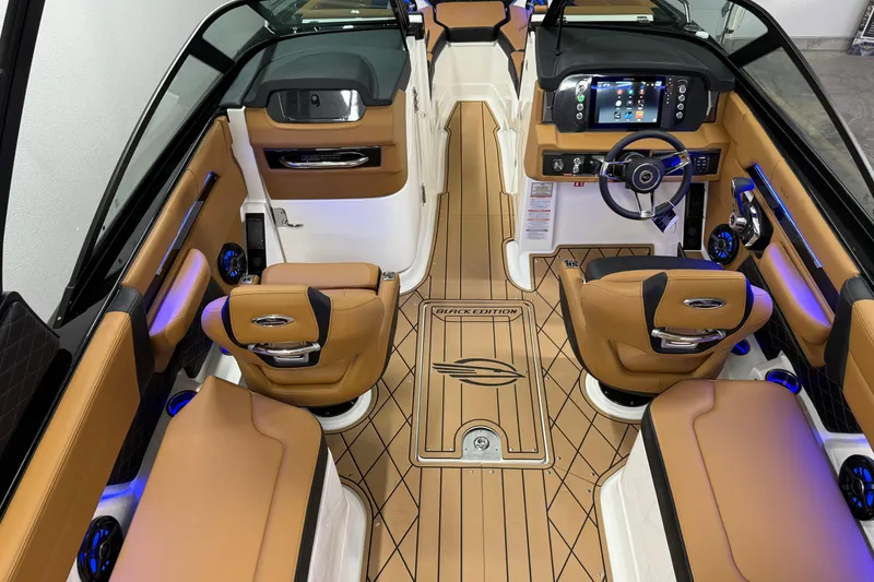 Slide: The Image of Luxurious interior of 2026 Chaparral SSX 6 boat with tan leather seating and modern dashboard. - 46