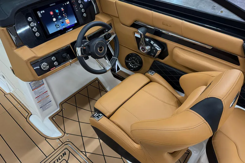 Slide: The Image of 2026 Chaparral SSX 6 boat interior with tan leather seating and modern dashboard. - 7