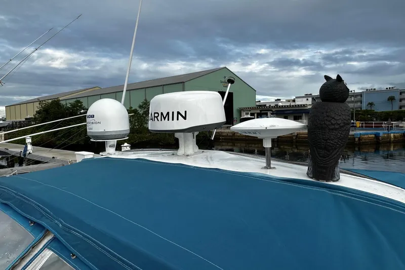 Slide: The Image of 2001 Sea Ray 380 Sundancer with Garmin radar and owl decoy on deck. - 11