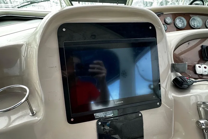 Slide: The Image of Garmin display on 2001 Sea Ray 380 Sundancer boat dashboard with gauges and controls. - 16