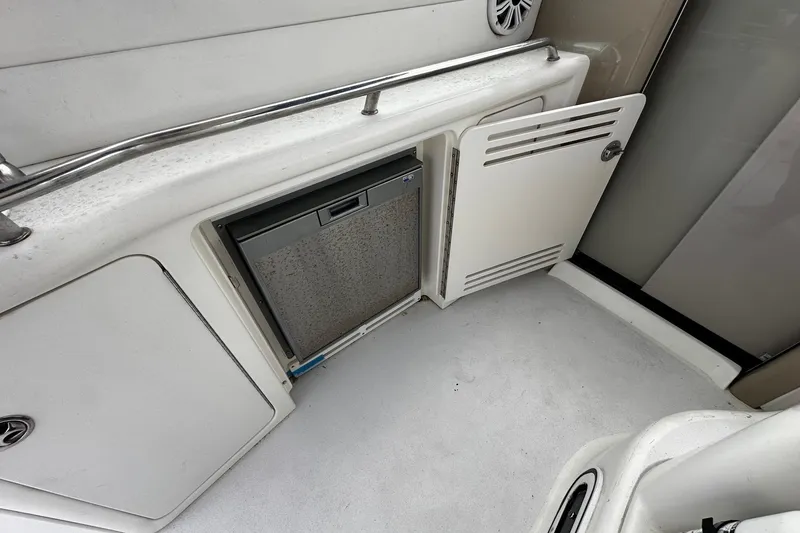 Slide: The Image of 2001 Sea Ray 380 Sundancer interior with open cabinet and built-in appliance. - 20