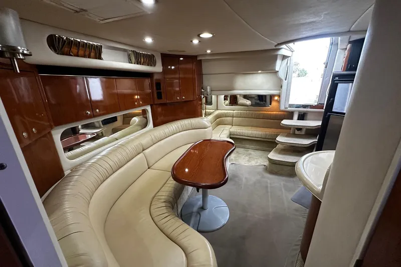 Slide: The Image of Luxurious interior of a 2001 Sea Ray 380 Sundancer yacht with elegant seating and wood finishes. - 31