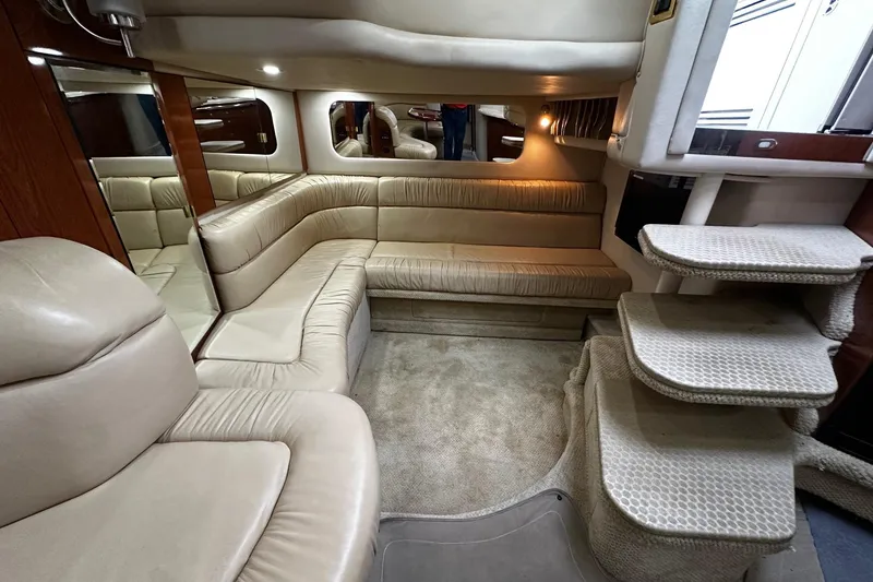 Slide: The Image of Luxurious interior of 2001 Sea Ray 380 Sundancer yacht with beige leather seating. - 33
