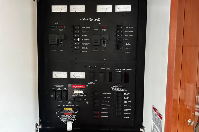 Slide: The Image of Electrical control panel of a 2001 Sea Ray 380 Sundancer boat. - 37